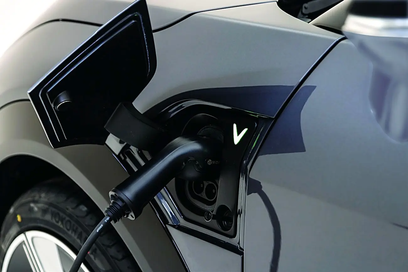 A charging cable plugged into a VinFast VF 7